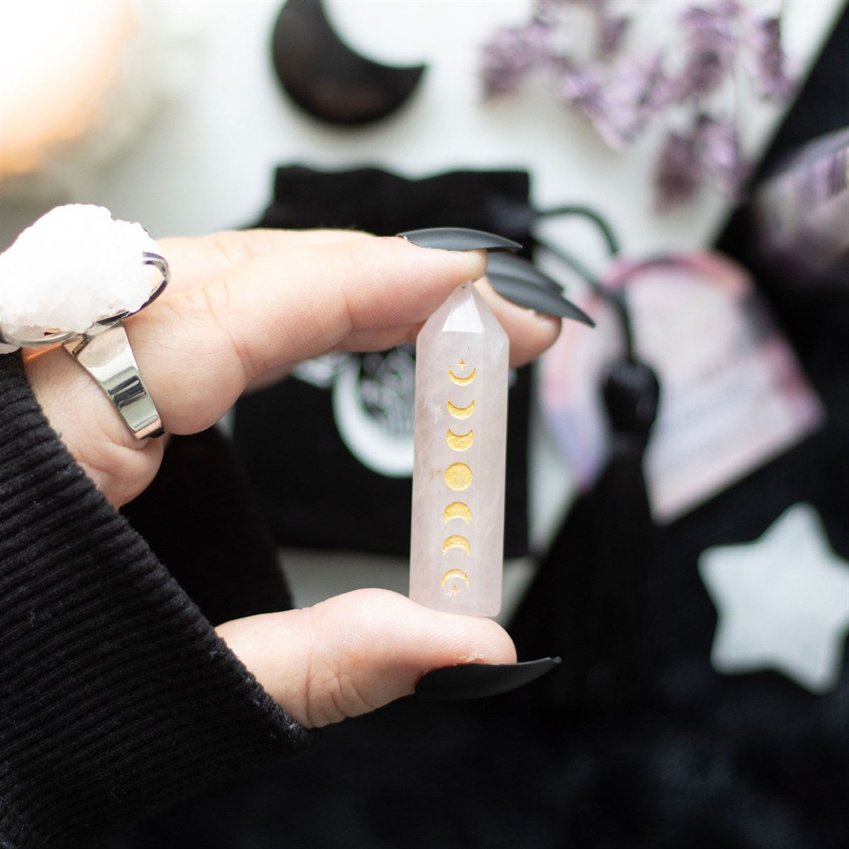 This beautiful rose quartz crystal point is perfect in size for travel altars, desk decor or taking on the go for extra protection. Features a gold-tone moon phase engraving and comes with a matching drawstring bag for storage and safe-keeping. Dimensions: H: 5cm x W: 1.2cm x D: 1.1cm