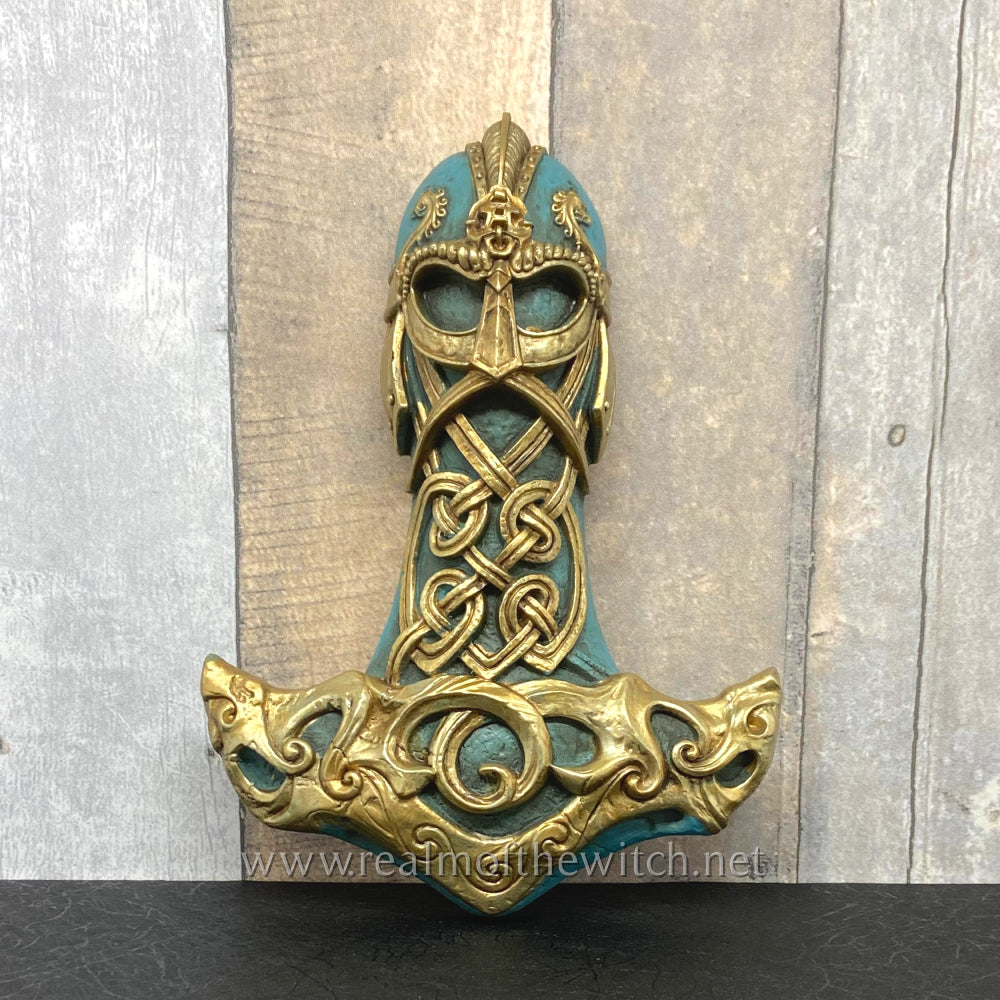 A beautifully decorated Thor's mighty hammer or Mjolnir commanding the primal energy of the storm. Cast resin decorative wall mount, hand painted and finished.  Dimensions (approx.): Approx. height 21cm.